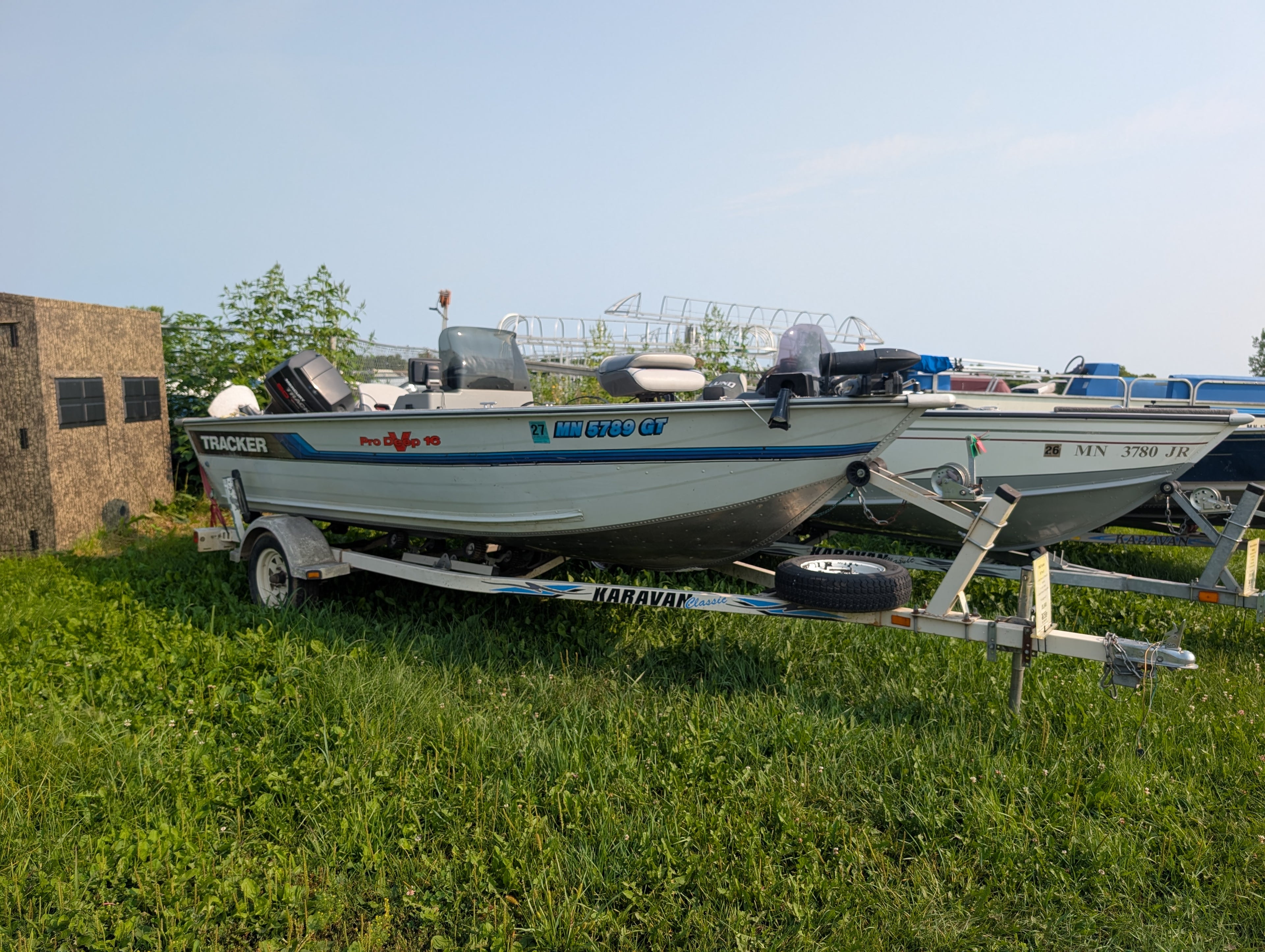 1995 Tracker Pro Deep 16 Deep-V Fishing Boat w/ 60HP Mercury 2-Stroke & Karavan Roller Trailer